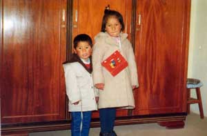 Erick at five years old with his sister in La Paz, Bolivia.